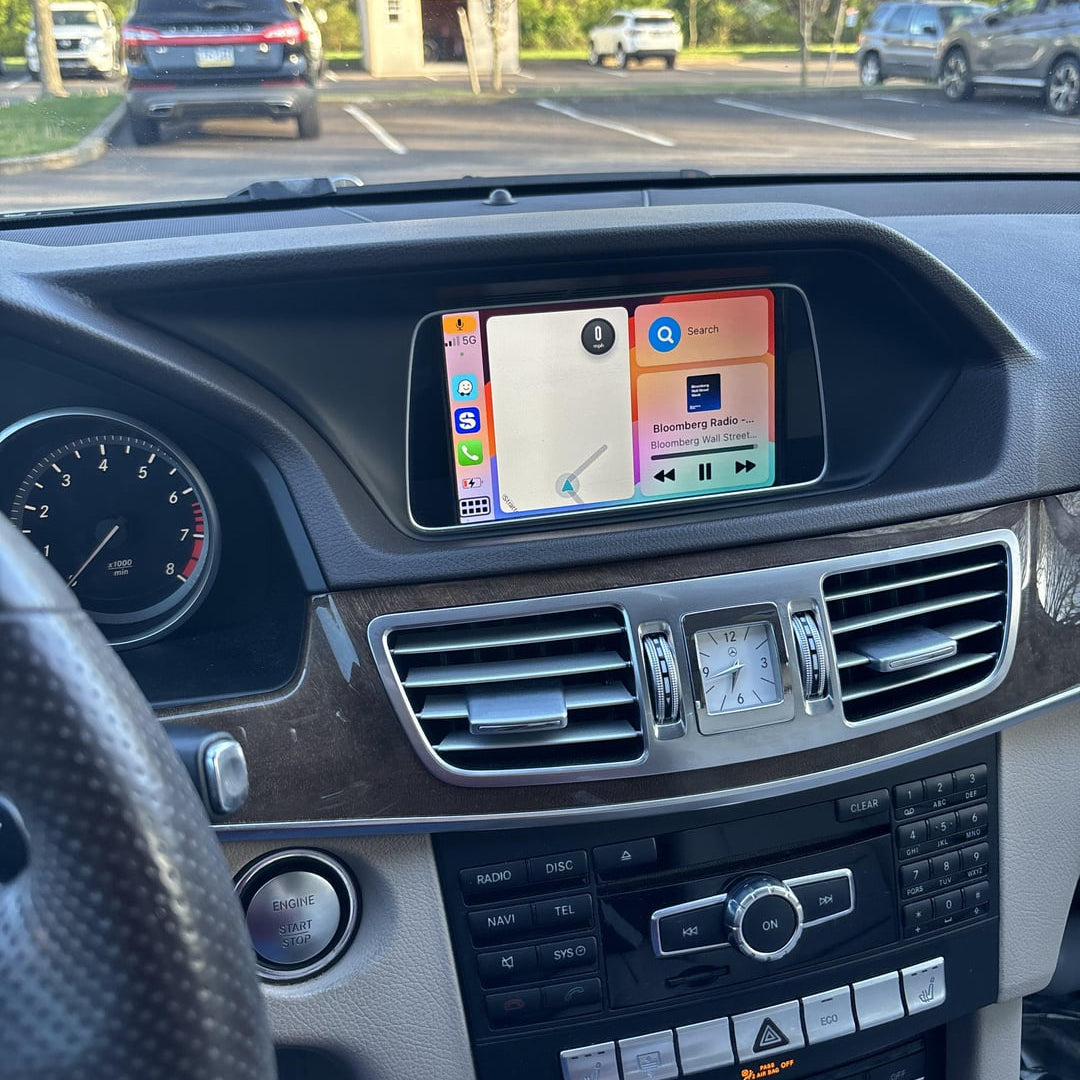 Mercedes-Benz e350 interior displaying the integrated wireless CarPlay system on the infotainment screen.