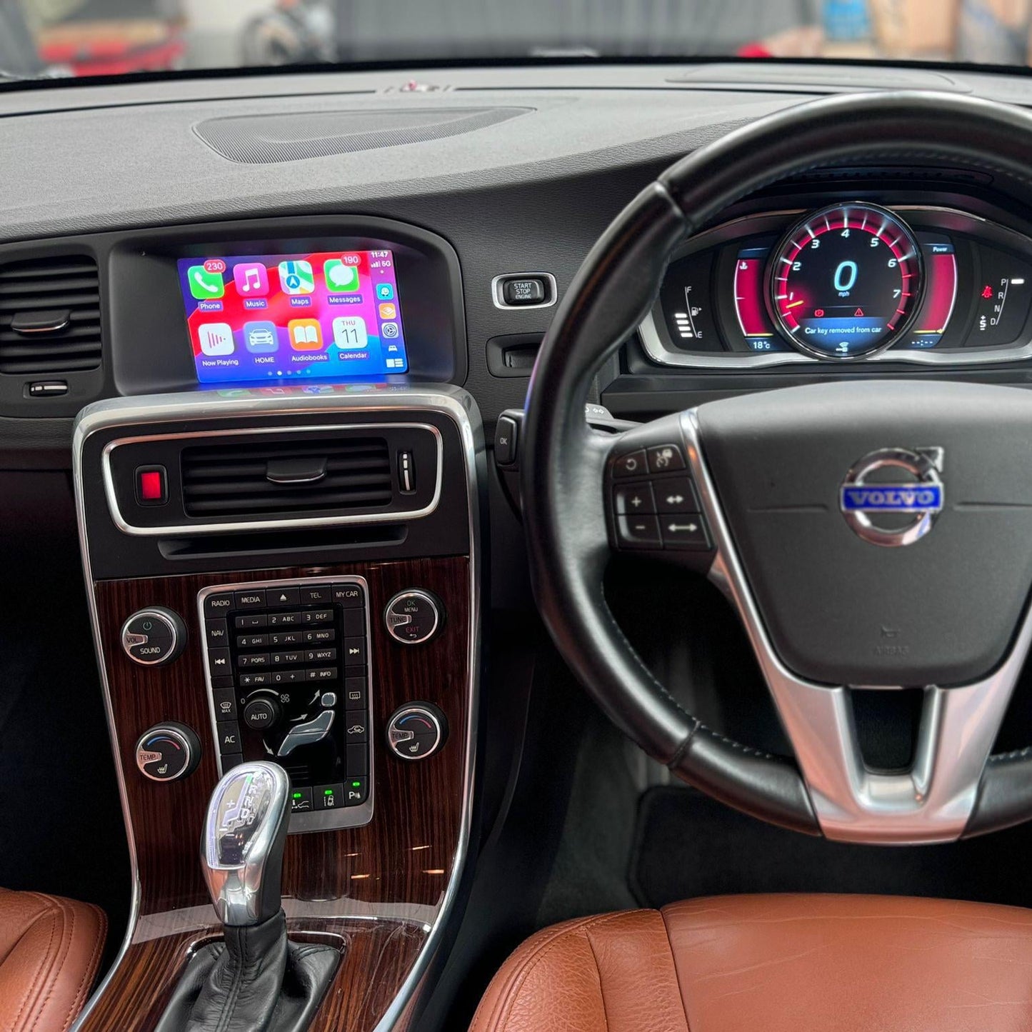 Volvo infotainment screen displaying the integrated wireless Apple CarPlay navigation.