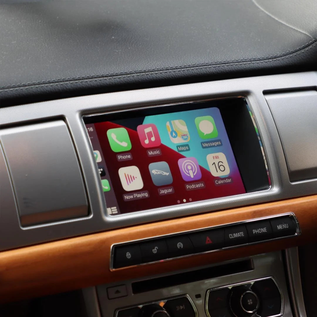 Jaguar XE interior showing the integrated wireless Apple CarPlay interface on the infotainment screen