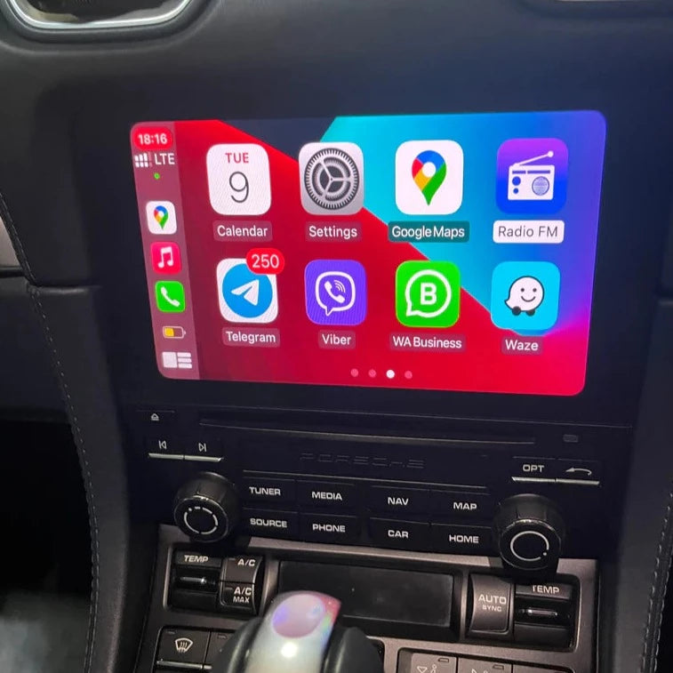 Porsche interior showing the integrated wireless Apple CarPlay interface on the infotainment screen.