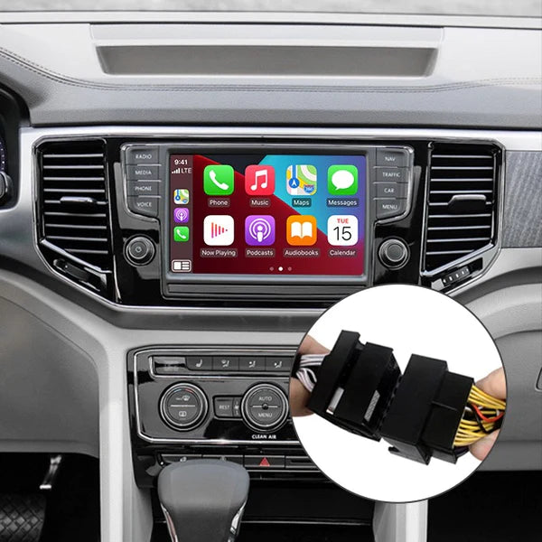 Volkswagen Amarok interior showing the integrated wireless Apple CarPlay interface on the infotainment screen with installation cables visible.
