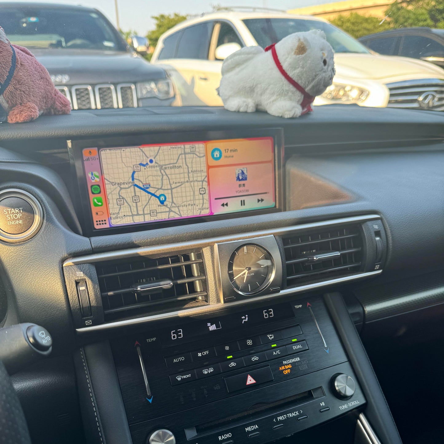 Lexus interior dashboard showing the integrated wireless Apple CarPlay interface on the infotainment screen.