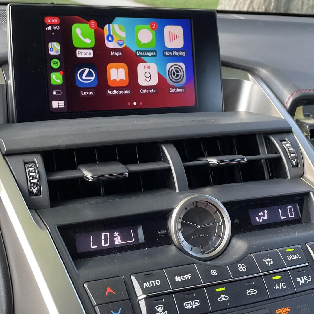 Lexus interior dashboard showing the integrated wireless Apple CarPlay interface on the infotainment screen.