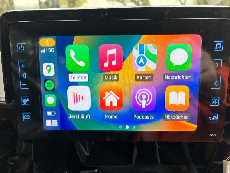 Toyota infotainment screen displaying the integrated wireless Apple CarPlay apps interface, brightly lit.